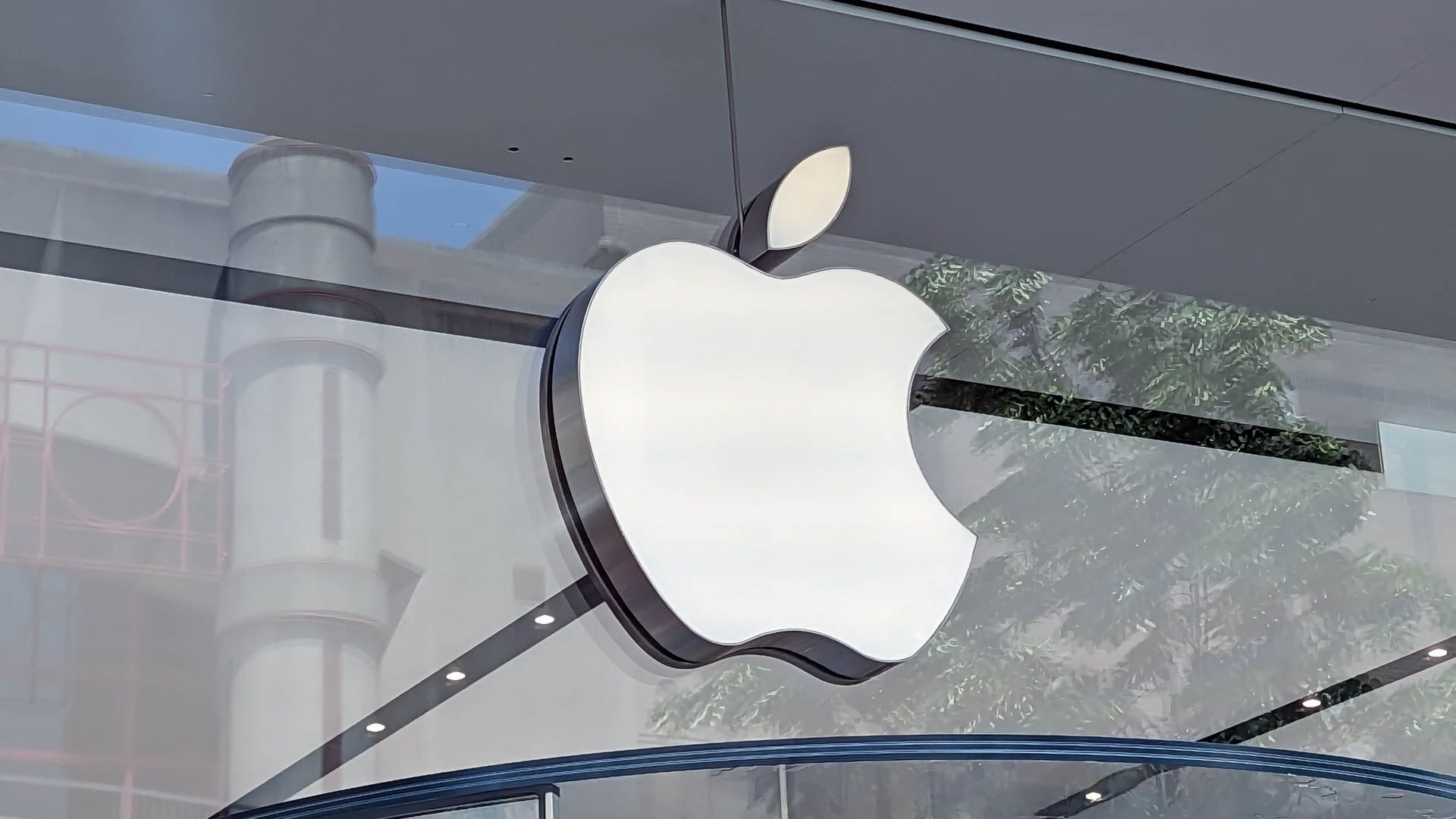 The Apple logo at the entrance of an Apple Store.