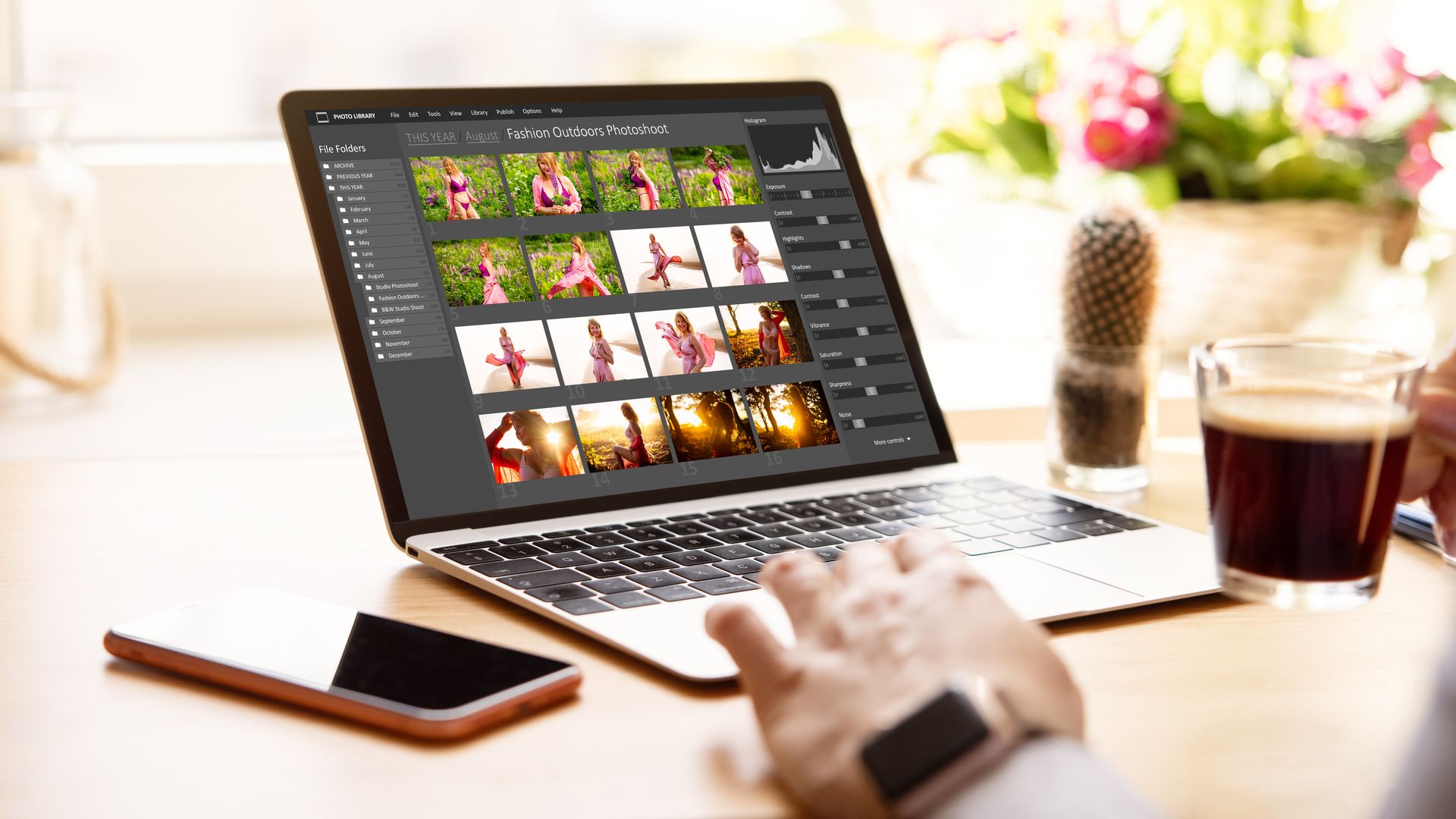 Woman editing digital photos on laptop.