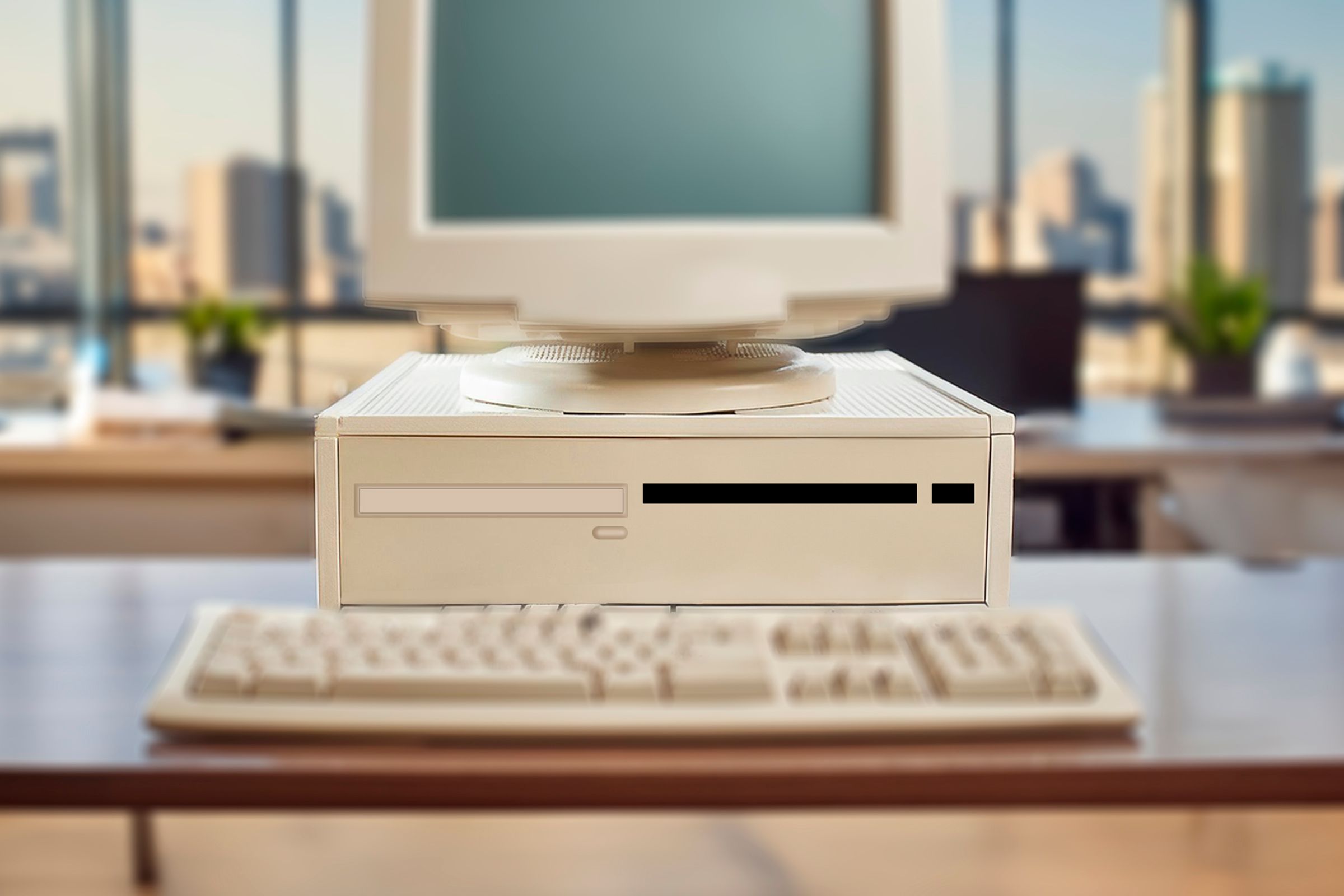 A horizontal PC case with a monitor on top of it.