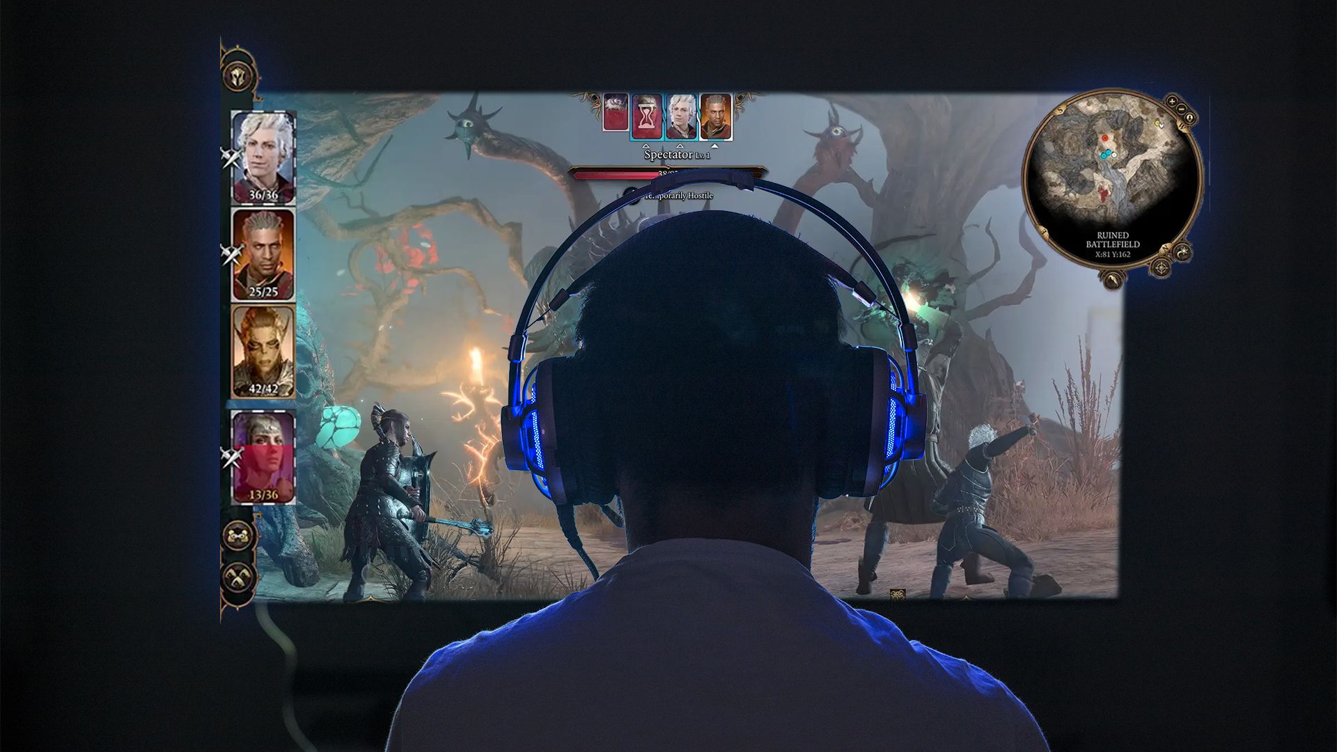 A person wearing headphones playing Baldur's Gate 3 on their PC.