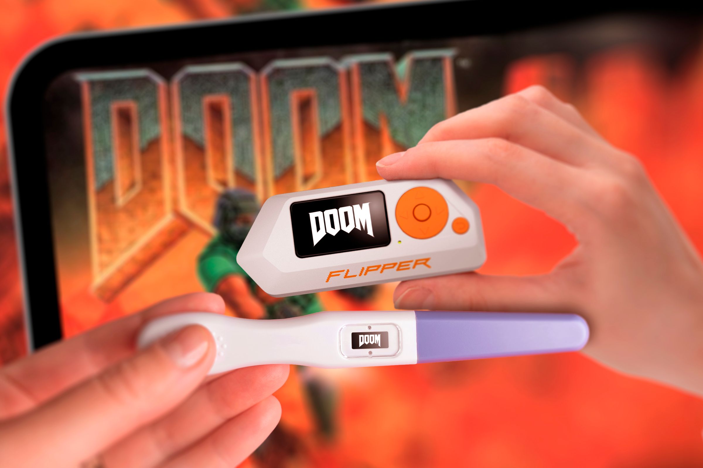 A pregnancy test and a Fipper Zero with Doom's logo.