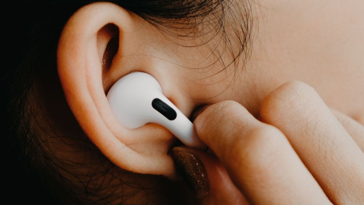 Apple AirPods Pro in a woman's ear