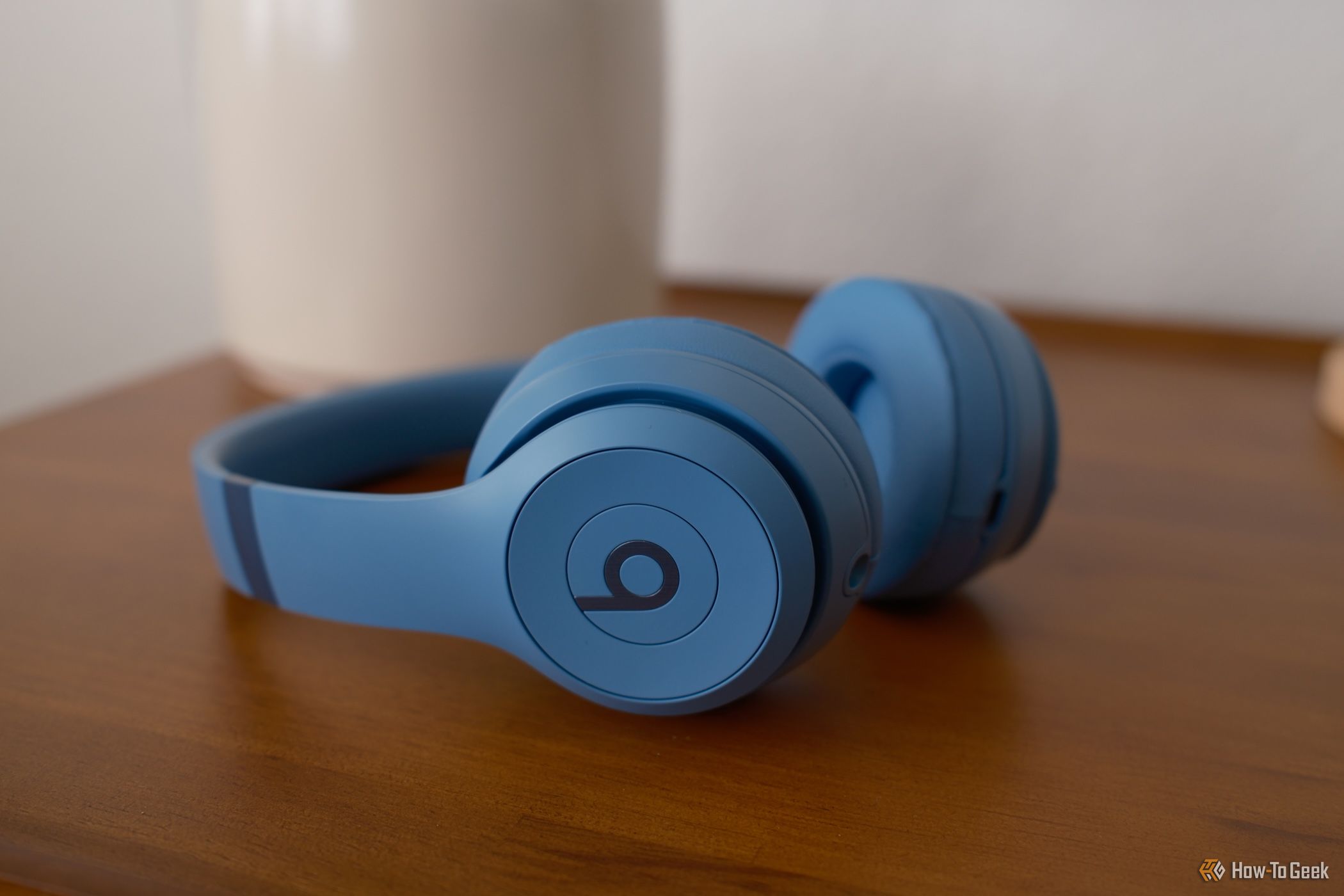 Beats Solo 4  in blue laying on a table