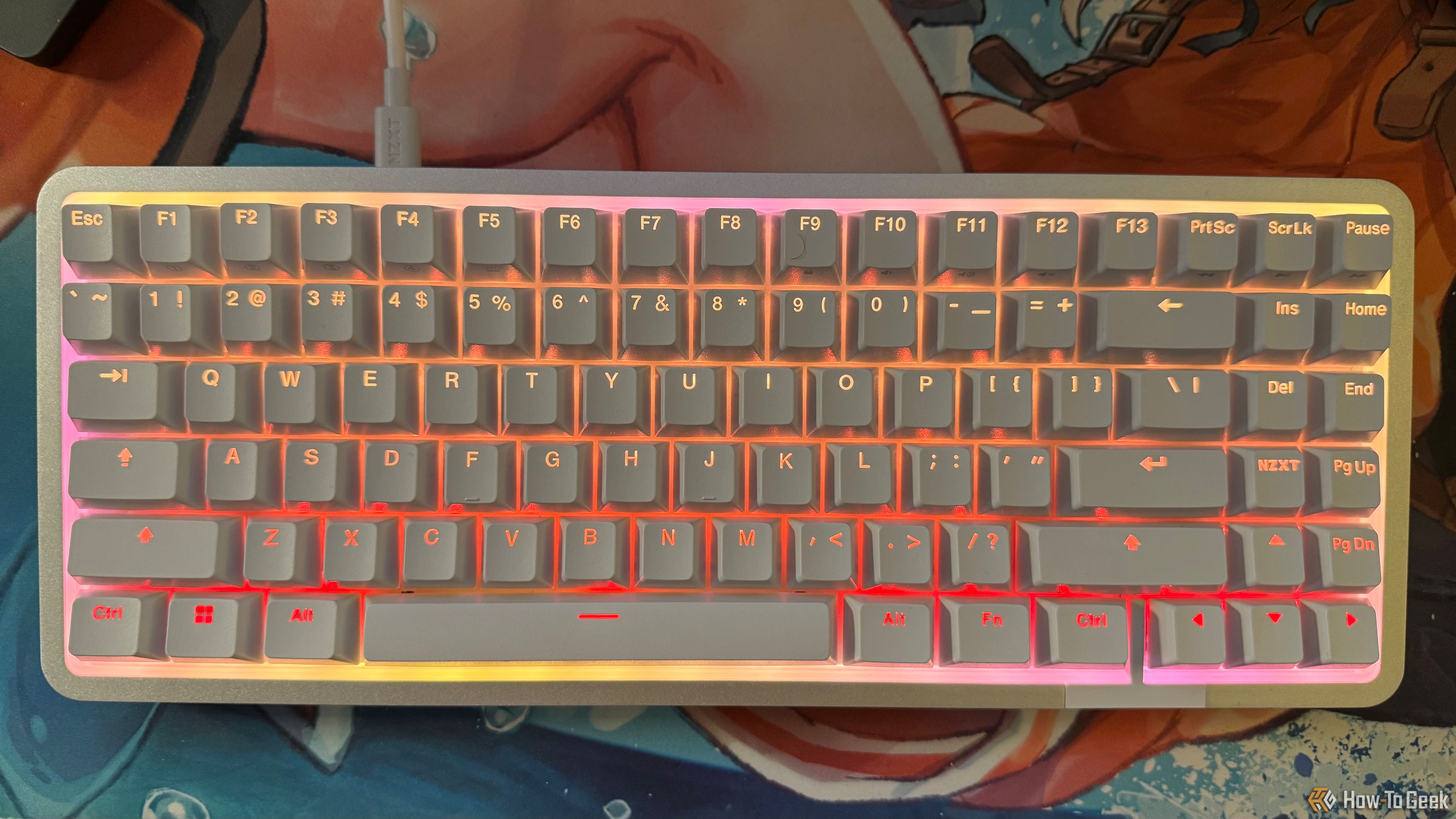 NZXT Function Elite MiniTKL magnetic keyboard with orange, red, and pink RGB colors.