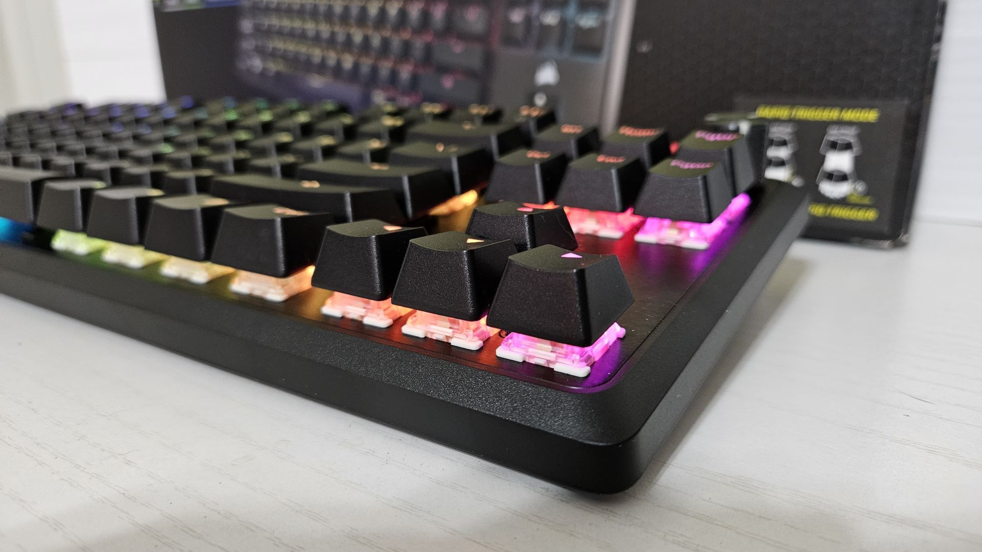 The Corsair K70 PRO TKL mechanical keyboard, with a focus on the large gaps between the keys and the surface.