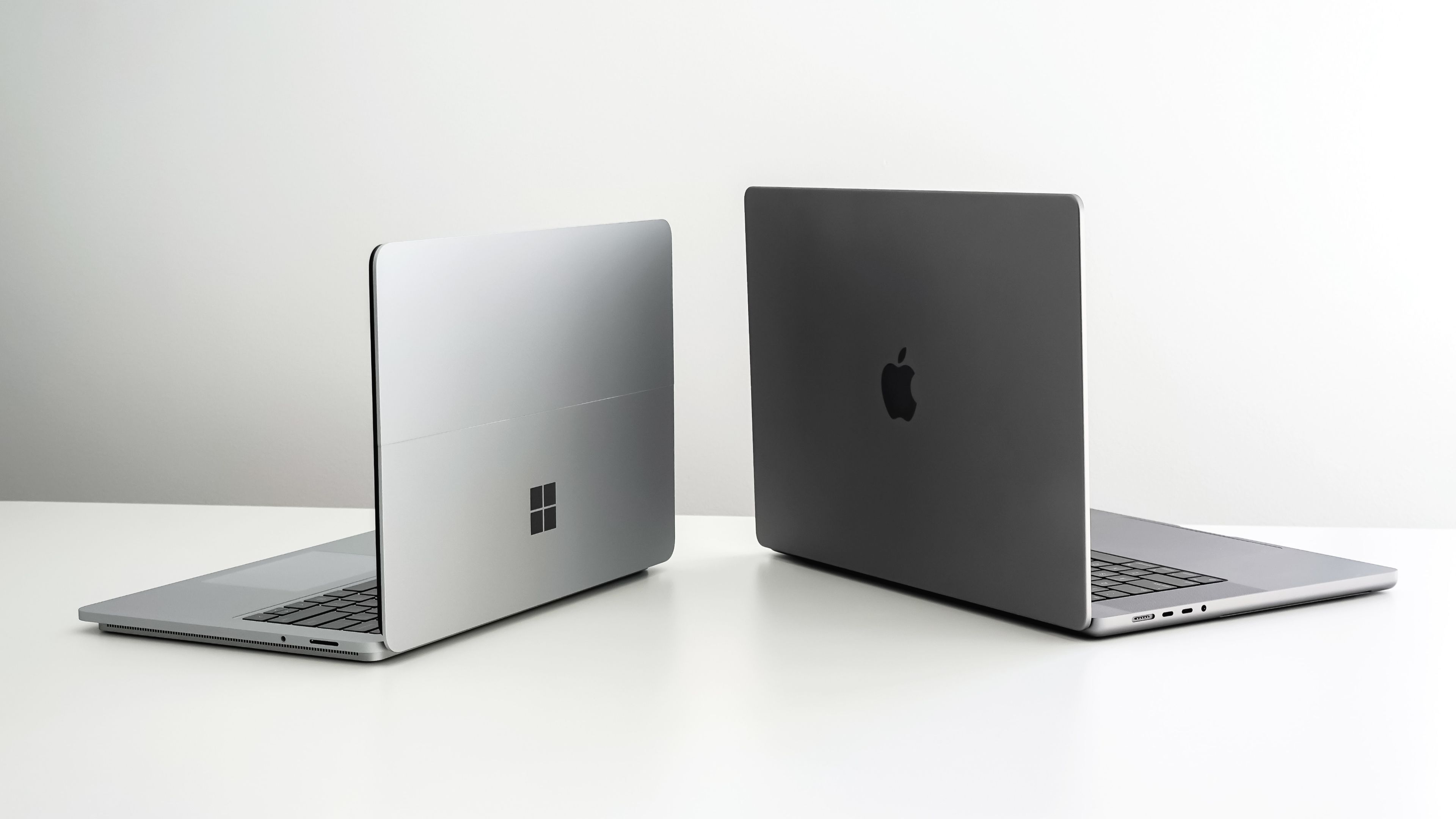 Microsoft Windows Surface laptop and Apple MacBook Pro.