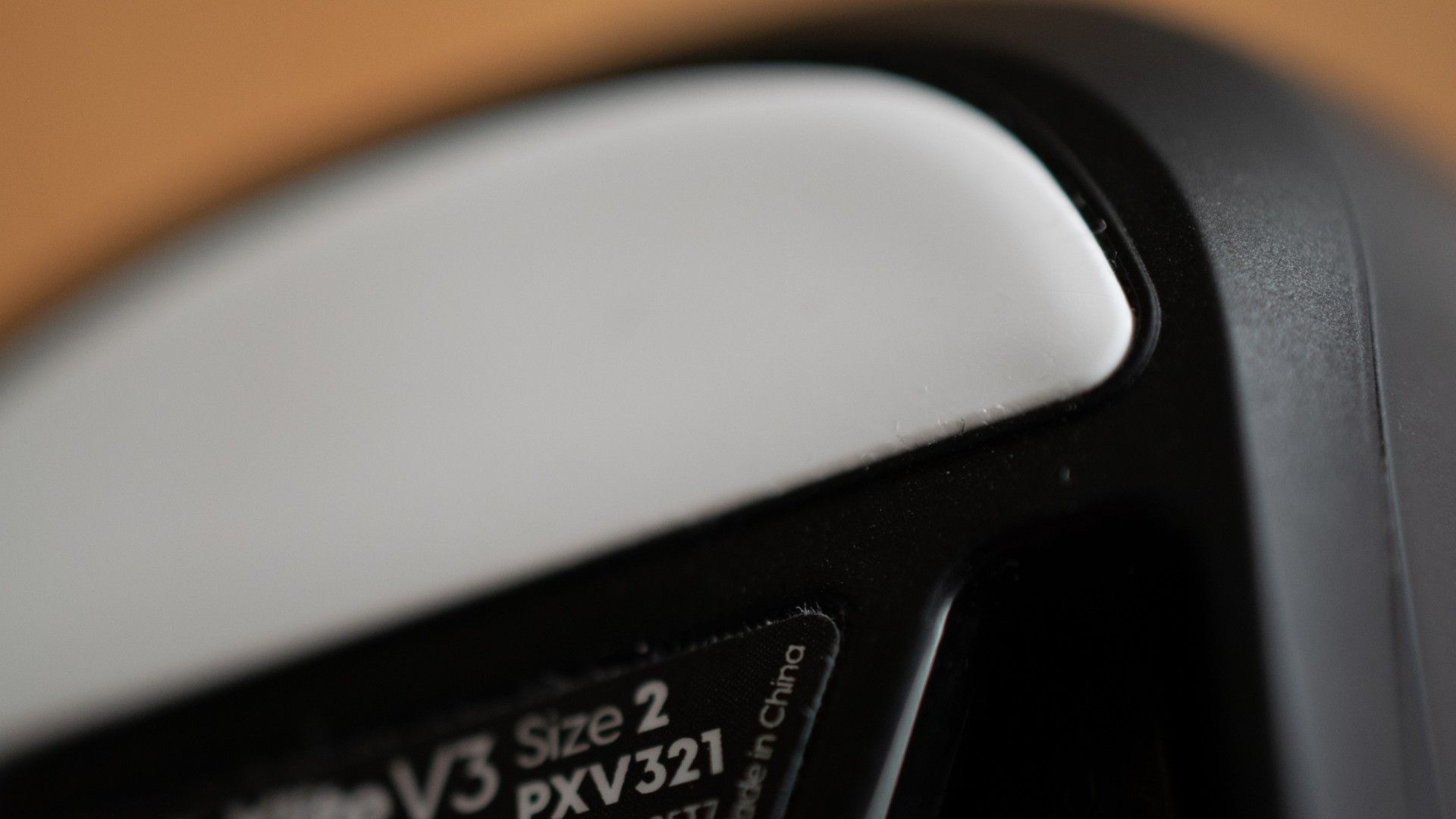 A closeup shot showing one of the feet of the Pulsar Xlite V3 gaming mouse.