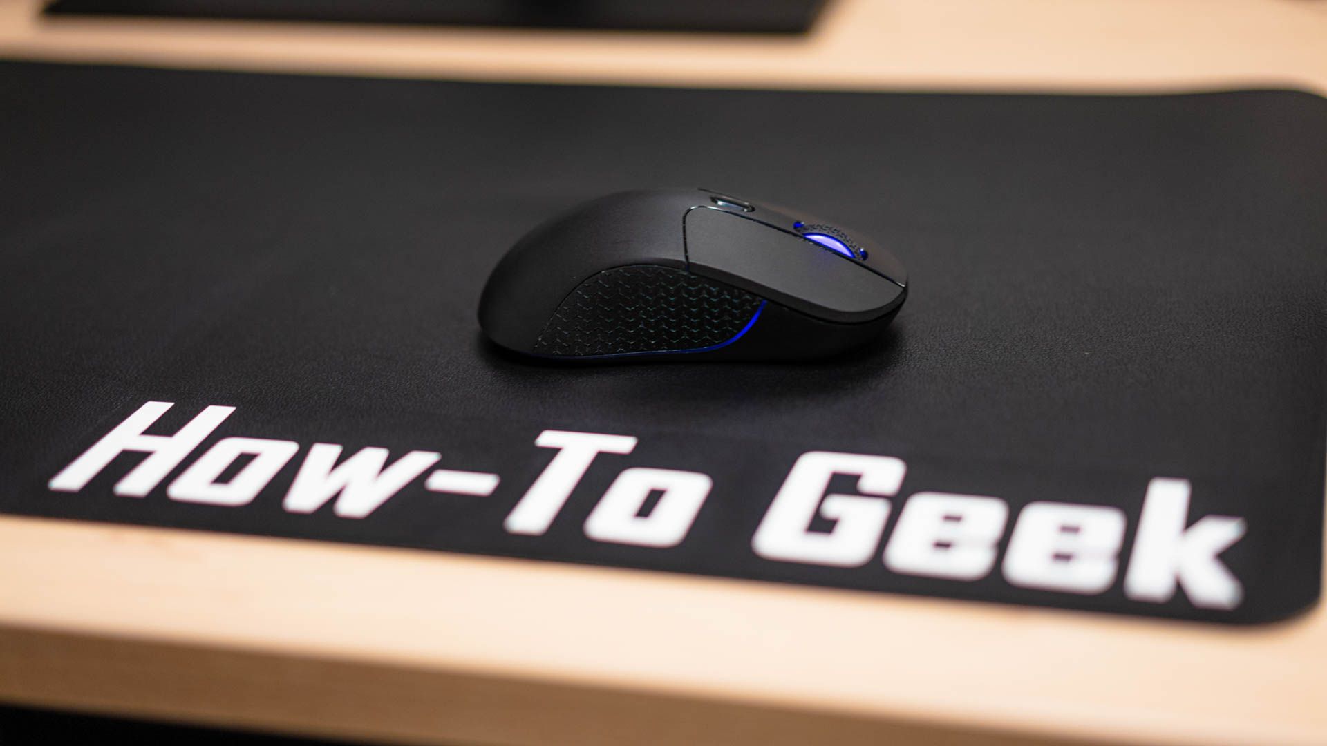 Keychron M3 Wireless Mouse on a How-To Geek desk mat.