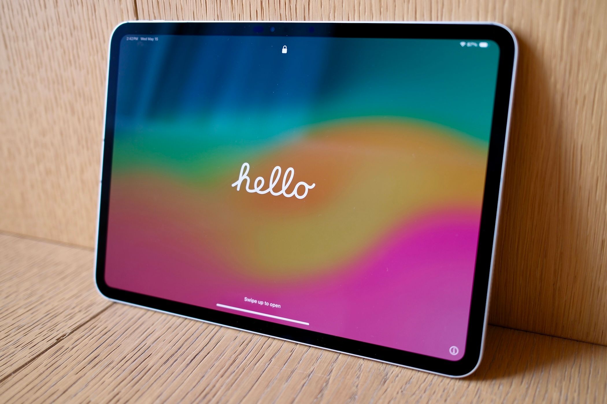 Apple iPad Pro (M4) leaning against a wall with the word hello on the screen.