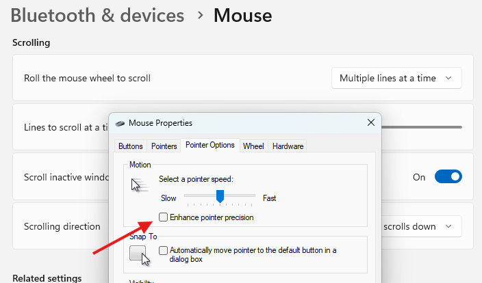 Advanced mouse settings menu in Windows 11 with a red arrow pointing to the 'Enhance Pointer Precision' checkbox.