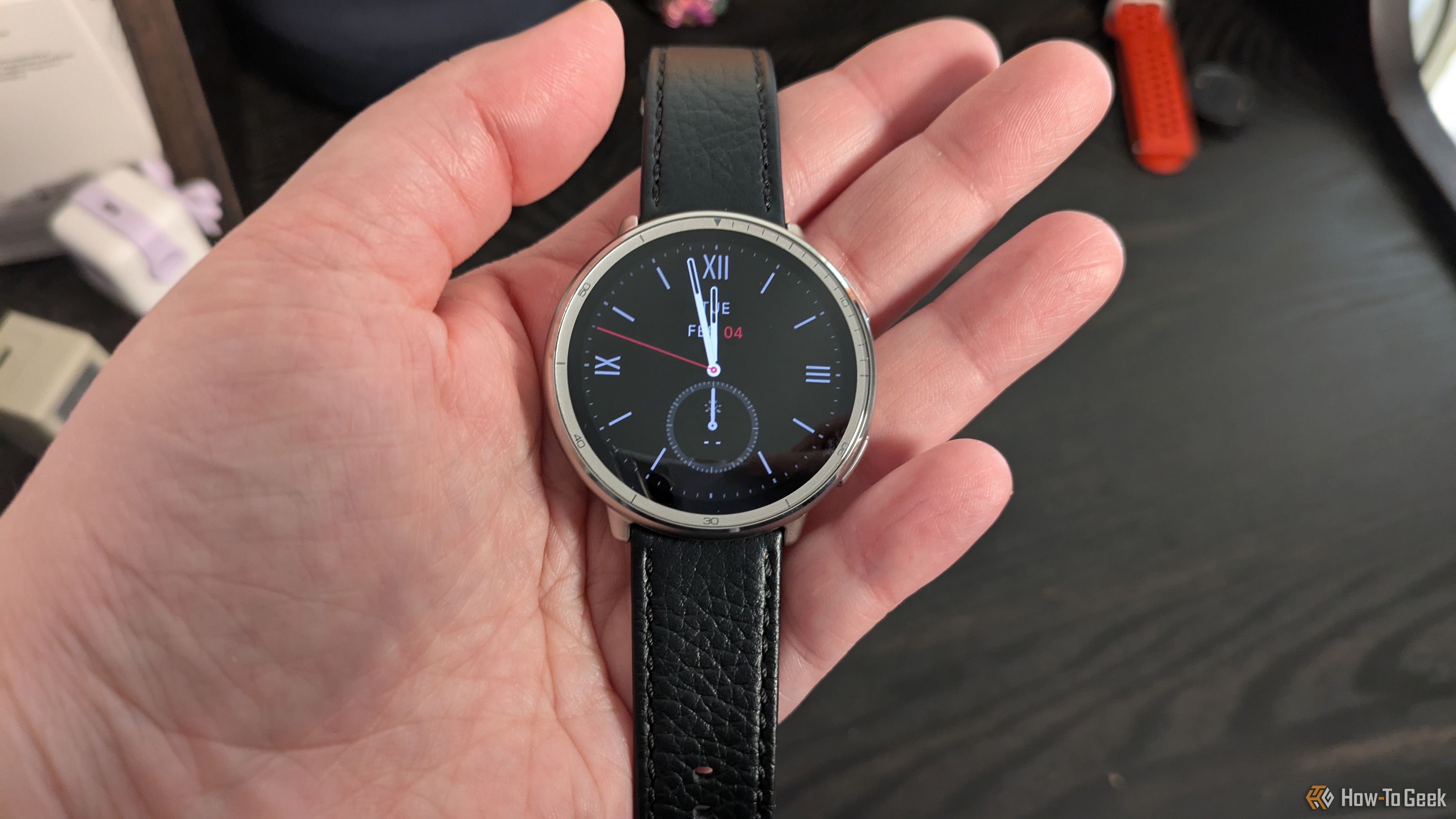 Amazfit Active 2 close-up in hand.