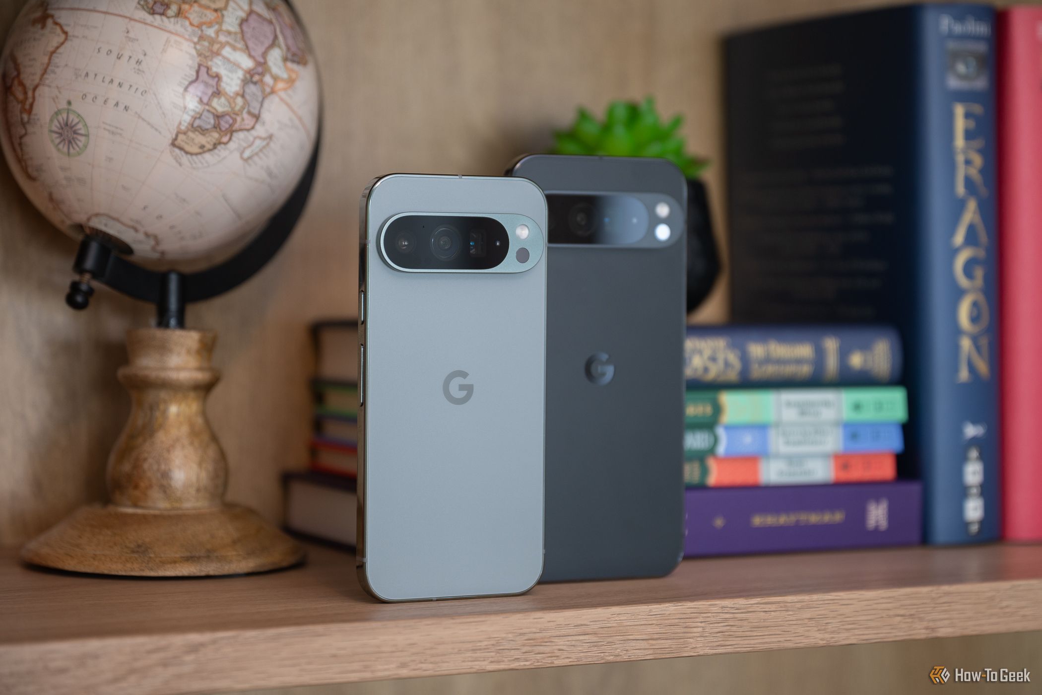 Google Pixel 9 Pro and 9 Pro XL standing on a shelf