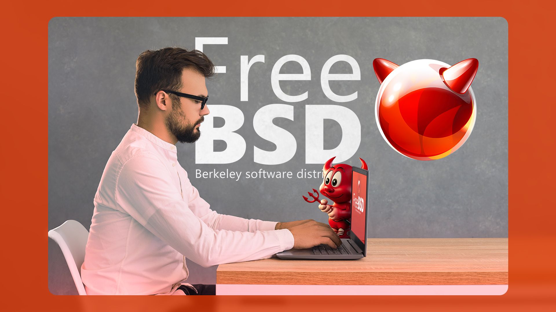 A man sitting at a desk, seen from the side, using his laptop with the FreeBSD logo in the background.