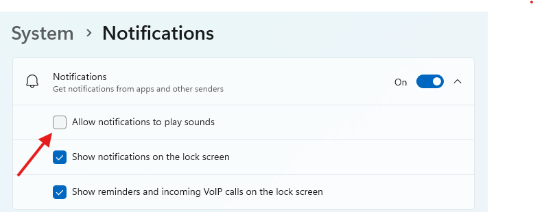 Notification settings in Windows 11 with an arrow pointing to the 'Allow notifications to play sounds' option.