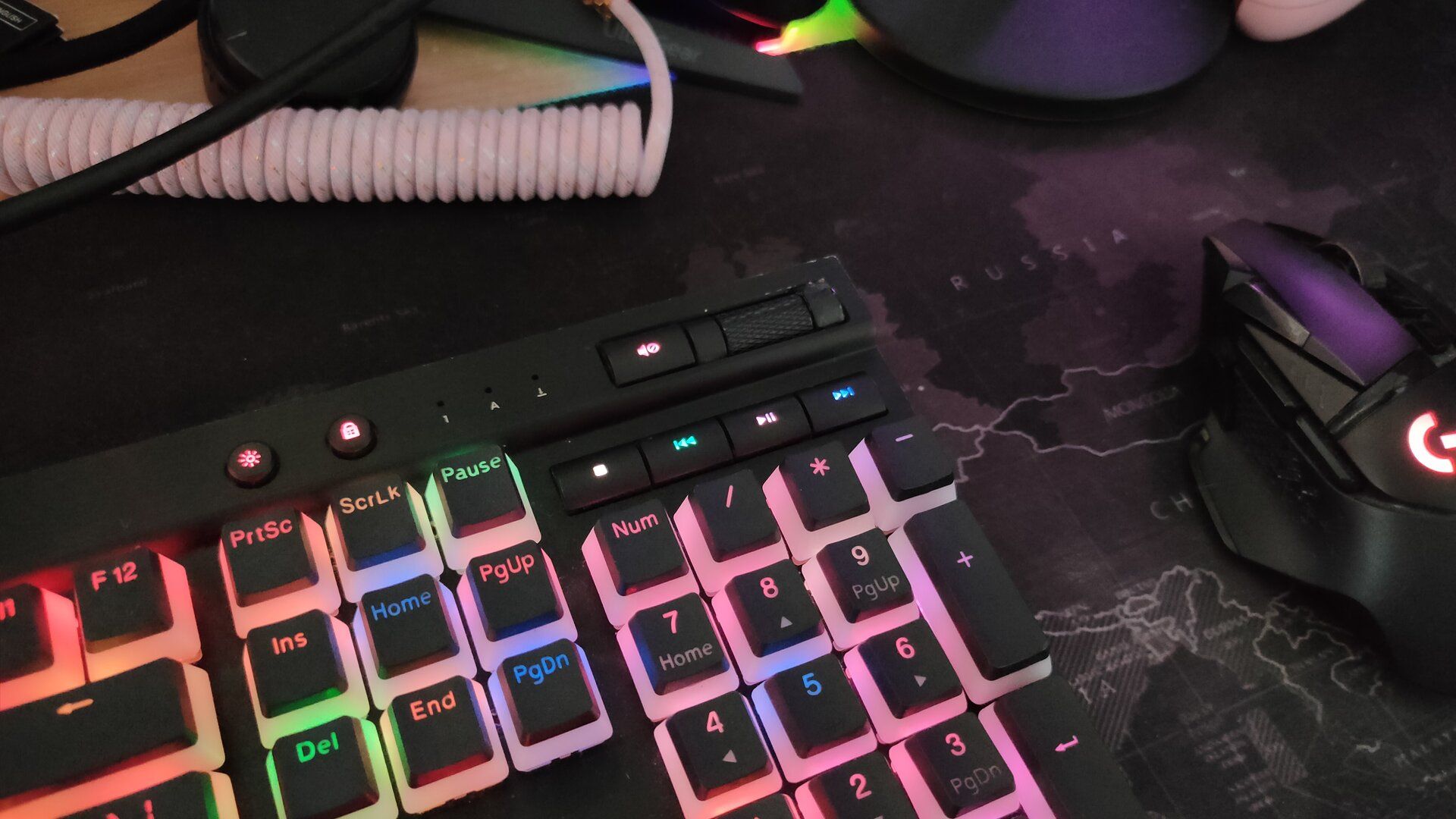 A close-up shot of the media controls on the Corsair K70 keyboard.