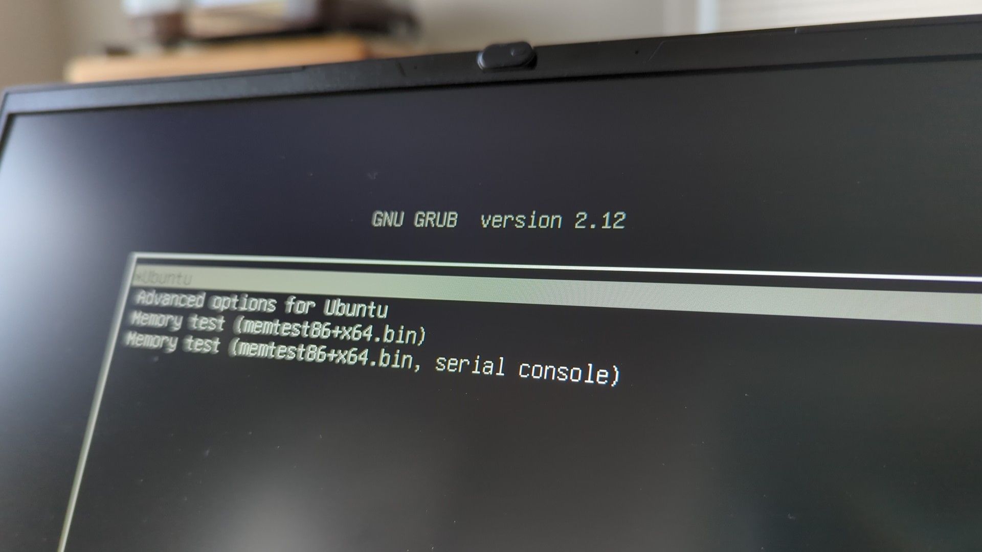 The GRUB2 boot loader on a laptop screen with Ubuntu as an option.